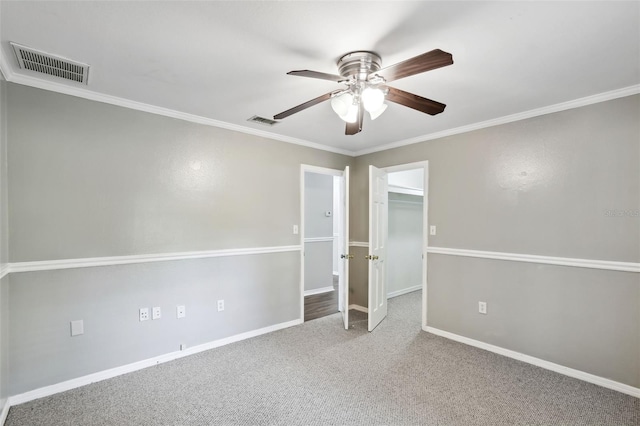16 Pine Forest Dr, Haines City, FL 33844 - unfurnished bedroom with carpet floors, ornamental molding, a ceiling fan, and a spacious closet