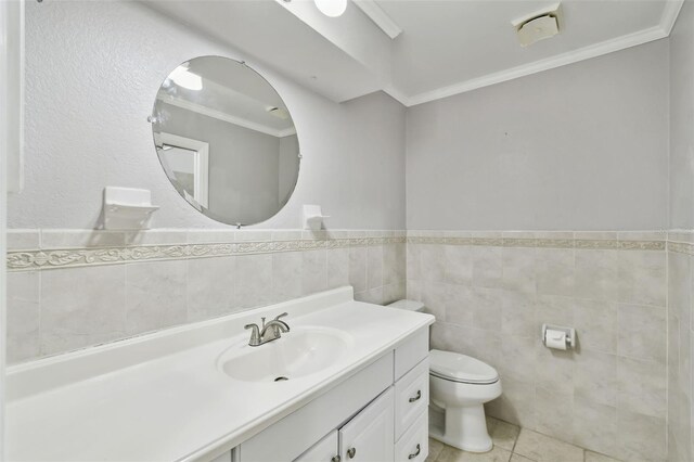16 Pine Forest Dr, Haines City, FL 33844 - bathroom with vanity, tile walls, tile patterned flooring, a wainscoted wall, and crown molding