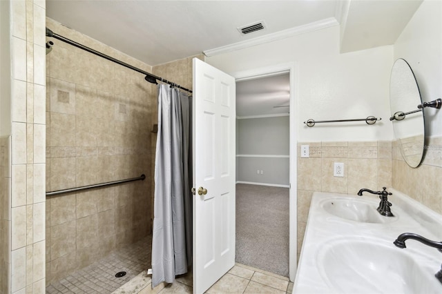 16 Pine Forest Dr, Haines City, FL 33844 - full bath with tiled shower, ornamental molding, tile patterned floors, and double vanity