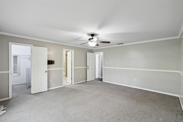 16 Pine Forest Dr, Haines City, FL 33844 - unfurnished bedroom with a spacious closet, carpet floors, crown molding, a closet, and a ceiling fan