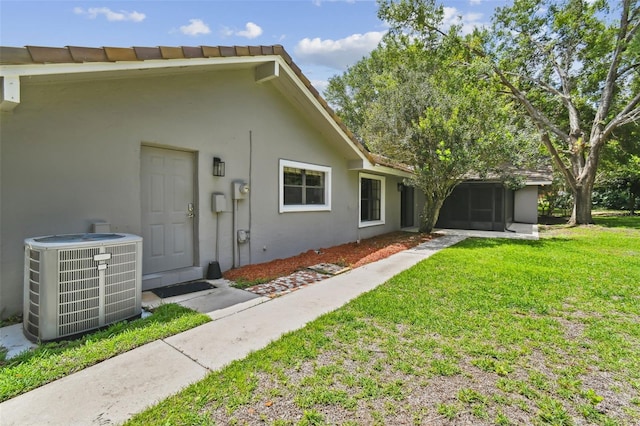 16 Pine Forest Dr, Haines City, FL 33844 - entrance to property featuring a lawn and stucco siding