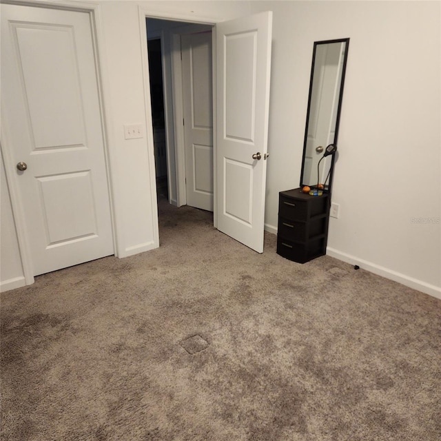 312 Lake Smart Cir, Winter Haven, FL 33881 - unfurnished bedroom with carpet floors and baseboards