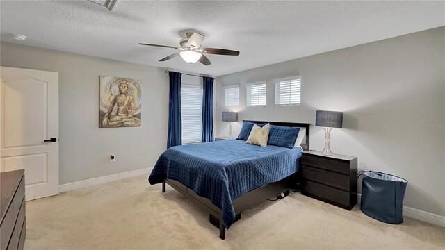 148 Whirlaway Dr, Davenport, FL 33837 - bedroom with light colored carpet, a ceiling fan, and a textured ceiling