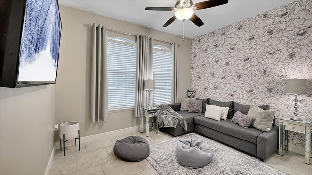 148 Whirlaway Dr, Davenport, FL 33837 - living room featuring ceiling fan, an accent wall, and wallpapered walls