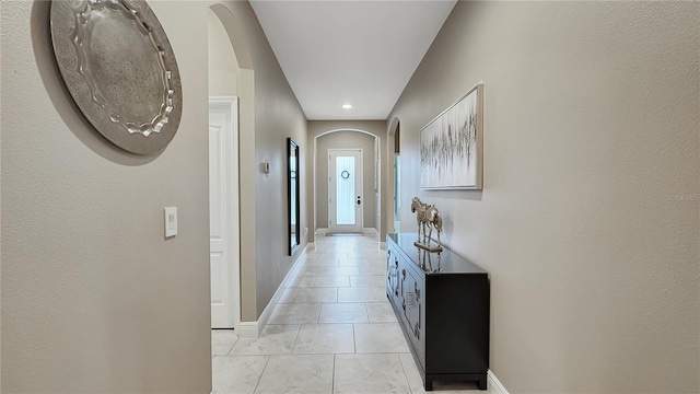148 Whirlaway Dr, Davenport, FL 33837 - corridor with arched walkways, recessed lighting, and light tile patterned floors