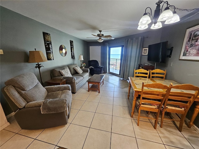3647 S Atlantic Ave Unit 3C, Daytona Beach, FL 32118 - living area featuring light tile patterned flooring, a chandelier, and ceiling fan
