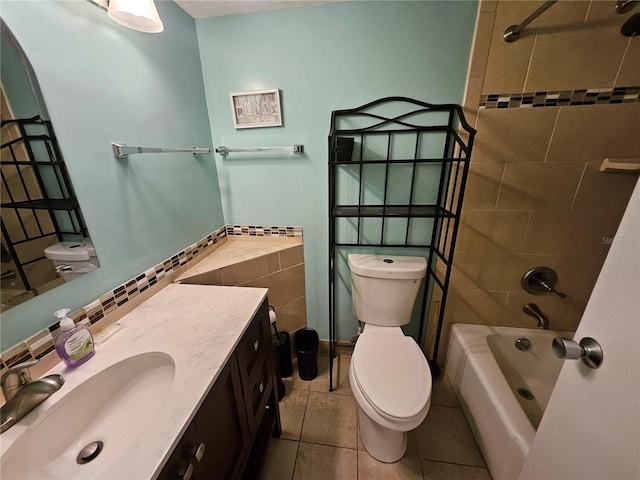 3647 S Atlantic Ave Unit 3C, Daytona Beach, FL 32118 - bathroom featuring toilet, vanity, bathtub / shower combination, and tile patterned floors