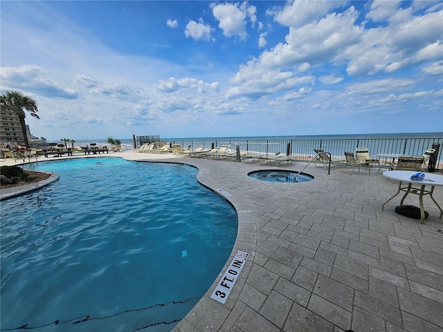 3647 S Atlantic Ave Unit 3C, Daytona Beach, FL 32118 - community pool with a patio area and a hot tub