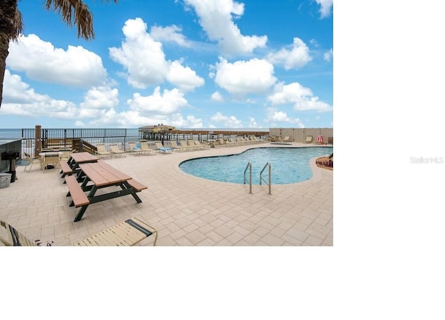 3647 S Atlantic Ave Unit 3C, Daytona Beach, FL 32118 - community pool with a patio area