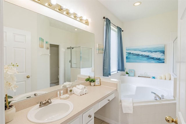 8491 Oasis Key Cv, Kissimmee, FL 34747 - full bath with vanity, a garden tub, a shower stall, and toilet