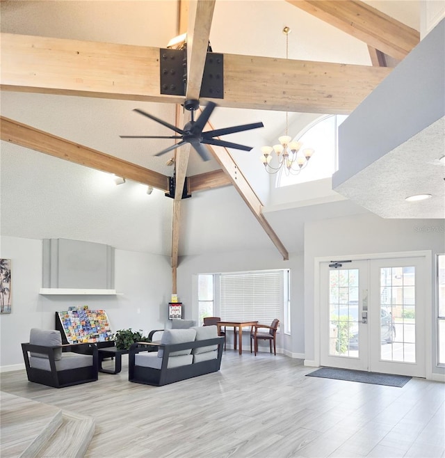 2735 N Poinciana Blvd Unit 95, Kissimmee, FL 34746 - living room featuring high vaulted ceiling, beam ceiling, healthy amount of natural light, baseboards, and a chandelier