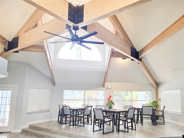 2735 N Poinciana Blvd Unit 95, Kissimmee, FL 34746 - dining area featuring beamed ceiling, a ceiling fan, wood finished floors, baseboards, and high vaulted ceiling