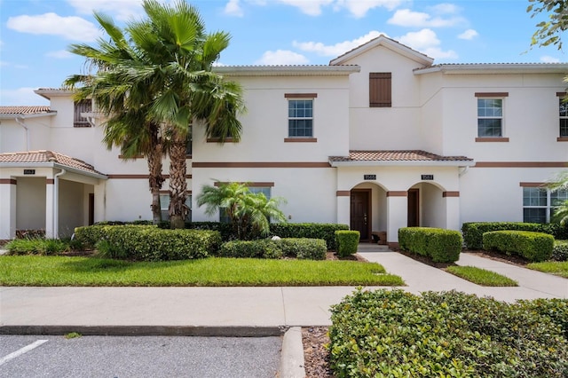 1565 Plunker Dr, Davenport, FL 33896 - view of front of house featuring stucco siding and a tile roof