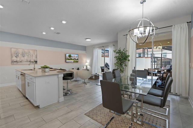 1565 Plunker Dr, Davenport, FL 33896 - dining area with a chandelier, recessed lighting, and baseboards