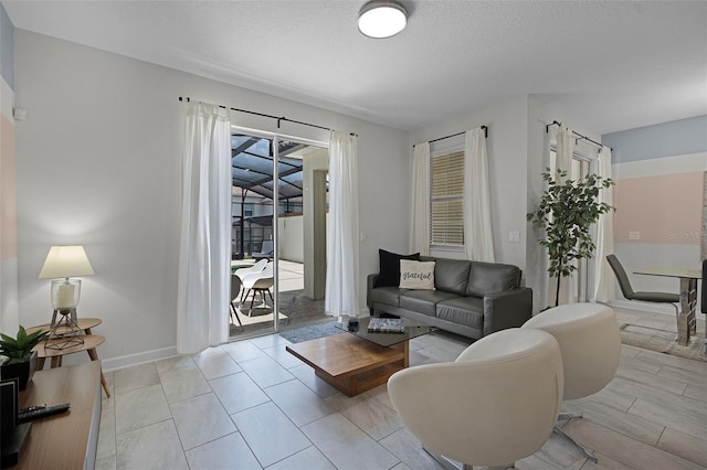 1565 Plunker Dr, Davenport, FL 33896 - living room with baseboards and a textured ceiling