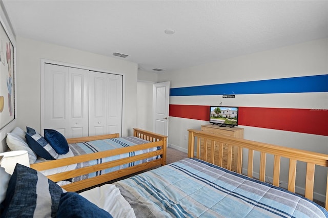 1565 Plunker Dr, Davenport, FL 33896 - carpeted bedroom featuring a closet and baseboards