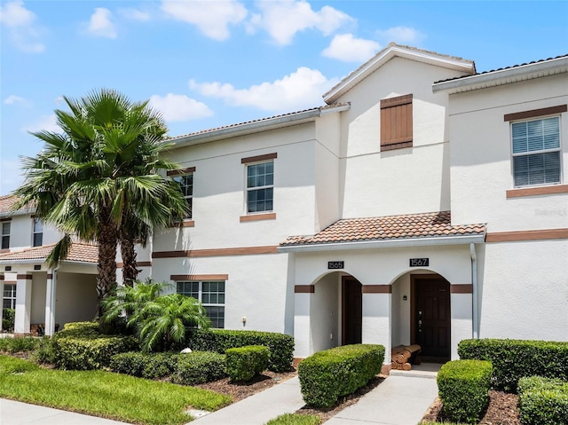 1565 Plunker Dr, Davenport, FL 33896 - mediterranean / spanish-style home featuring a tile roof and stucco siding