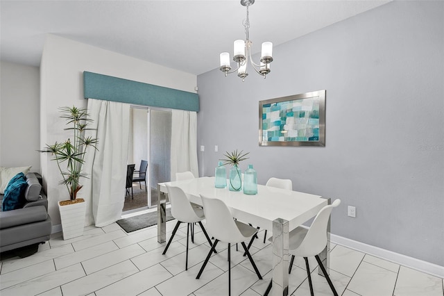 1578 Slice Way, Davenport, FL 33896 - dining room with a chandelier, light marble finish flooring, and baseboards