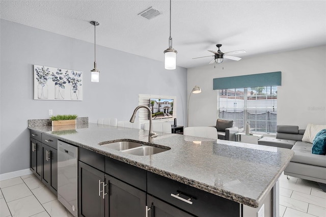 1578 Slice Way, Davenport, FL 33896 - kitchen featuring stainless steel dishwasher, open floor plan, a ceiling fan, stone countertops, and a peninsula