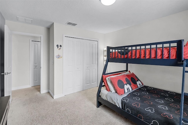 1578 Slice Way, Davenport, FL 33896 - carpeted bedroom with a closet, baseboards, and a textured ceiling