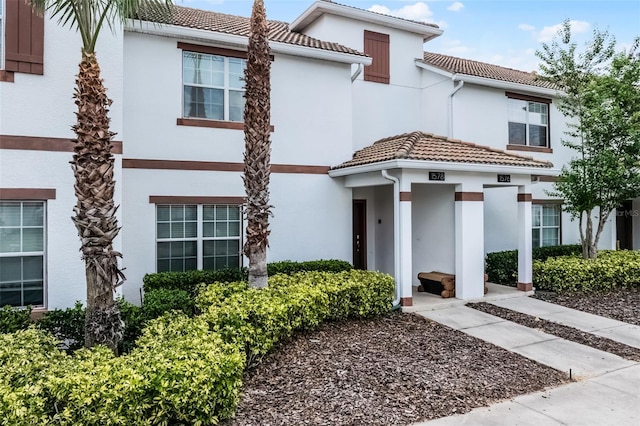1578 Slice Way, Davenport, FL 33896 - mediterranean / spanish-style home with a tiled roof and stucco siding