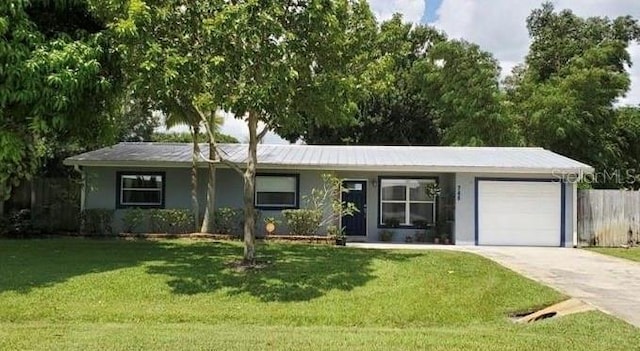 745 17th Ave, Vero Beach, FL 32962 - ranch-style house with an attached garage and driveway