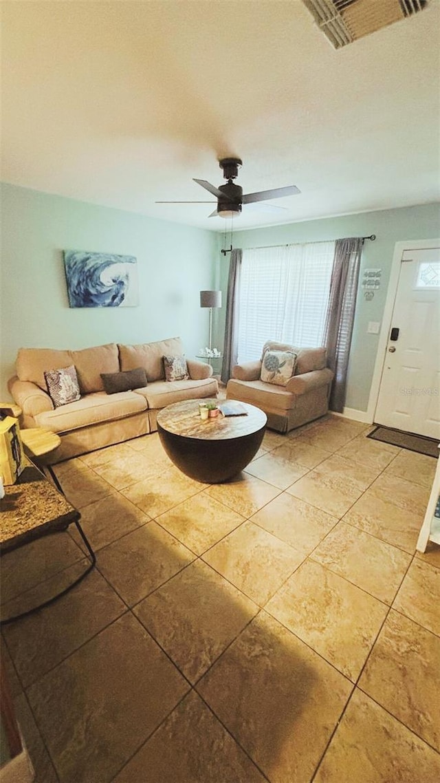 745 17th Ave, Vero Beach, FL 32962 - living room with plenty of natural light, a ceiling fan, and light tile patterned floors