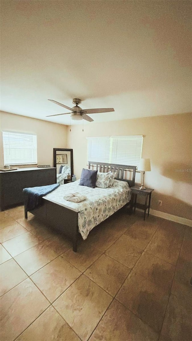 745 17th Ave, Vero Beach, FL 32962 - tiled bedroom with ceiling fan and baseboards
