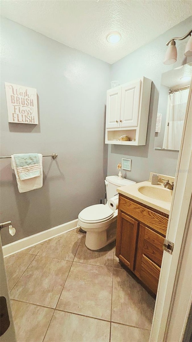 745 17th Ave, Vero Beach, FL 32962 - full bathroom featuring vanity, a textured ceiling, tile patterned floors, and curtained shower