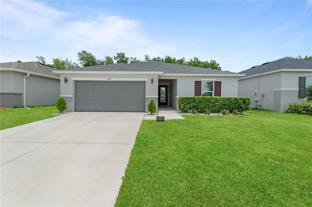 2461 Bulrush Dr, Saint Cloud, FL 34769 - view of front facade with an attached garage, driveway, stucco siding, and a front lawn