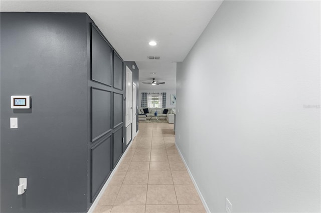 2461 Bulrush Dr, Saint Cloud, FL 34769 - hall featuring light tile patterned floors and baseboards