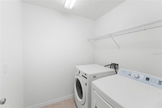 2461 Bulrush Dr, Saint Cloud, FL 34769 - laundry area with washing machine and dryer and baseboards