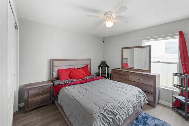 2461 Bulrush Dr, Saint Cloud, FL 34769 - bedroom with wood finished floors, baseboards, and a ceiling fan
