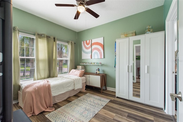 1064 Quaker Ridge Ln, Davenport, FL 33896 - bedroom featuring wood finished floors and a ceiling fan