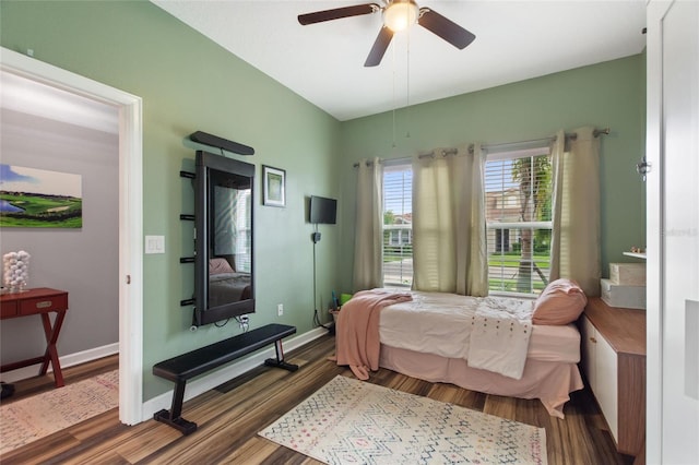1064 Quaker Ridge Ln, Davenport, FL 33896 - bedroom with wood finished floors, ceiling fan, and baseboards