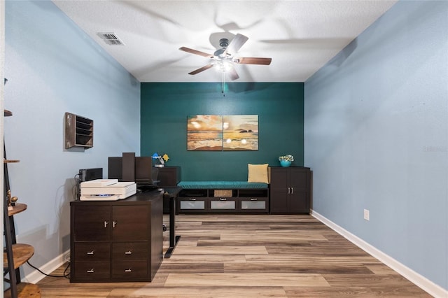 1064 Quaker Ridge Ln, Davenport, FL 33896 - home office featuring a ceiling fan, light wood finished floors, and baseboards