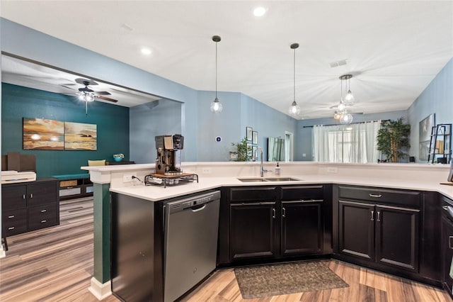 1064 Quaker Ridge Ln, Davenport, FL 33896 - kitchen with dishwasher, a sink, a ceiling fan, light wood-type flooring, and light countertops