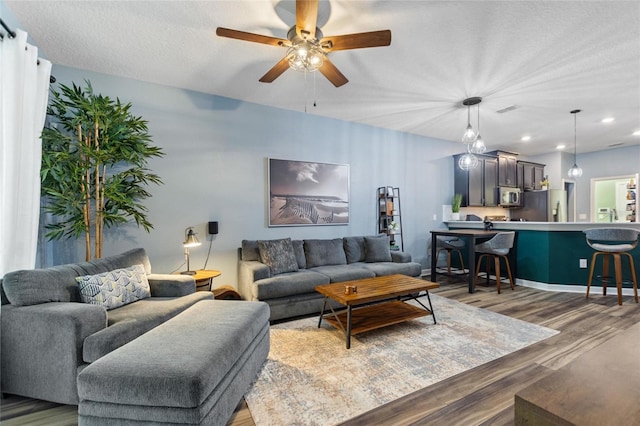 1064 Quaker Ridge Ln, Davenport, FL 33896 - living room featuring wood finished floors, a ceiling fan, and recessed lighting