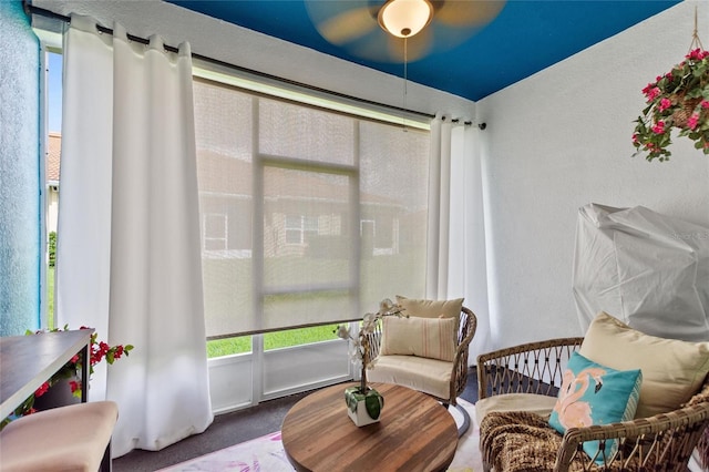 1064 Quaker Ridge Ln, Davenport, FL 33896 - living area featuring carpet floors and a ceiling fan