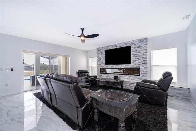 2503 Calla Lily Cv, Kissimmee, FL 34758 - living room with ceiling fan, light marble finish floors, and baseboards