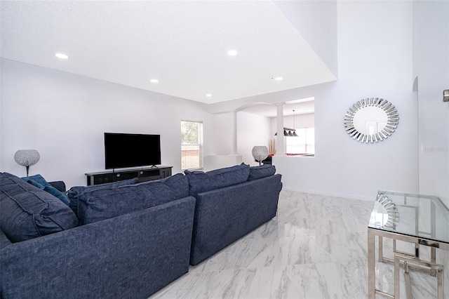 2503 Calla Lily Cv, Kissimmee, FL 34758 - living room with decorative columns, light marble finish floors, and recessed lighting