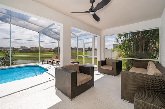 2503 Calla Lily Cv, Kissimmee, FL 34758 - outdoor pool with a patio area, a ceiling fan, an outdoor living space, and glass enclosure