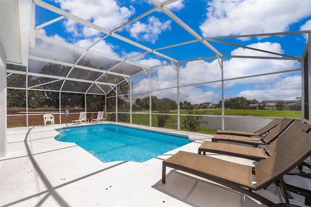 2503 Calla Lily Cv, Kissimmee, FL 34758 - outdoor pool featuring a patio area and glass enclosure