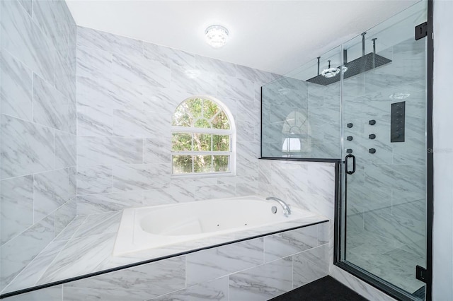 2503 Calla Lily Cv, Kissimmee, FL 34758 - full bath featuring a tub with jets and a shower stall