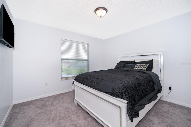 2503 Calla Lily Cv, Kissimmee, FL 34758 - carpeted bedroom featuring baseboards and a textured ceiling