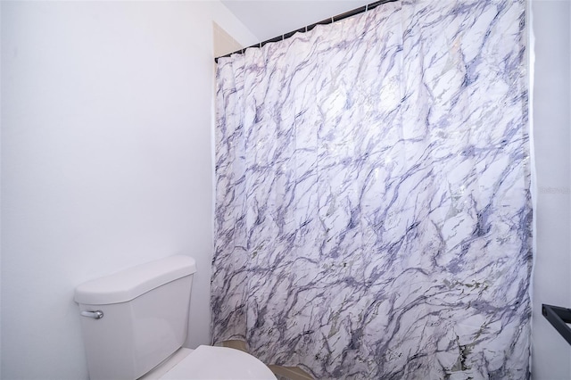 2503 Calla Lily Cv, Kissimmee, FL 34758 - bathroom with toilet and a shower with shower curtain