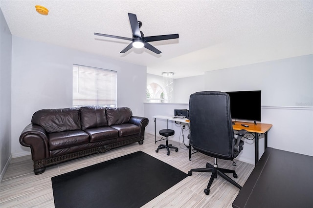 2503 Calla Lily Cv, Kissimmee, FL 34758 - office featuring a ceiling fan, light wood finished floors, a textured ceiling, and baseboards