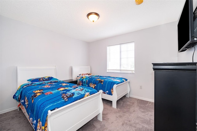 2503 Calla Lily Cv, Kissimmee, FL 34758 - carpeted bedroom featuring baseboards and a textured ceiling