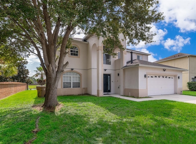 2503 Calla Lily Cv, Kissimmee, FL 34758 - mediterranean / spanish house with stucco siding, a garage, concrete driveway, and a front yard