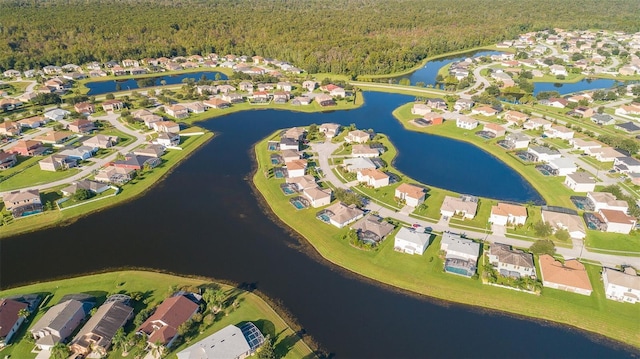2503 Calla Lily Cv, Kissimmee, FL 34758 - aerial view of property's location with a forest, nearby suburban area, and a large body of water